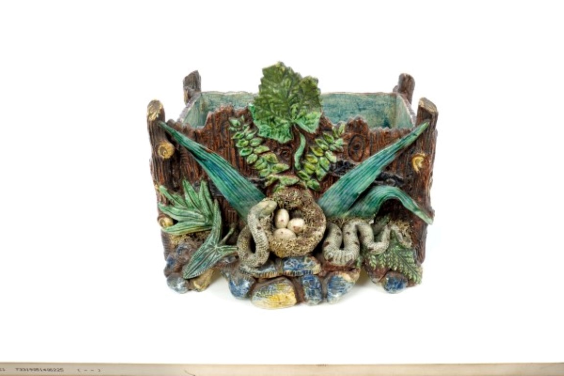 Late 19th century Portuguese Palissy ware trough of rustic form, with snake stealing eggs from a