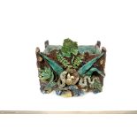 Late 19th century Portuguese Palissy ware trough of rustic form, with snake stealing eggs from a