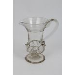 Early 19th century glass jug with trailed decoration, loop handle, moulded body on knopped stem on