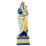 19th century Continental Majolica tin glazed pottery figure of Madonna and child, on square base,