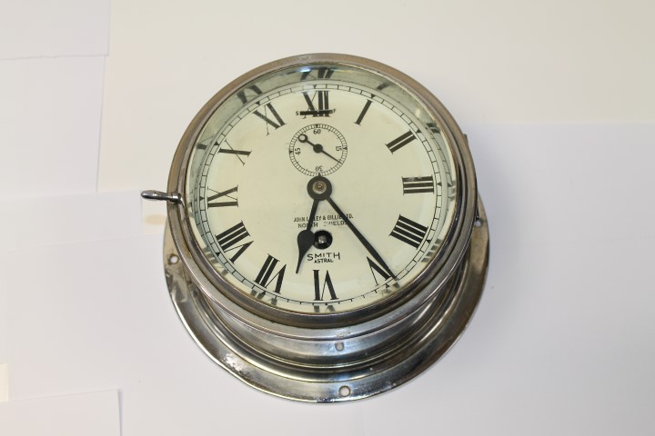 Early 20th century Smiths Astral ship bulkhead clock with white six inch dial with Roman numerals,