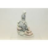 Lladro figure group of a seated lady watching her pigs - printed and impressed marks to base,