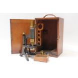 Late 19th / early 20th century brass microscope with some clear slides,