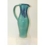 Usch Spettigue studio pottery ewer with graduated blue and turquoise decoration, incised initials to