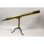 Brass telescope with integral tripod stand in a fitted wooden case