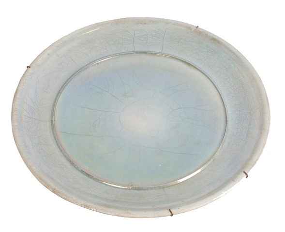Large studio pottery charger with blue lustre crackle glaze, signed - J. D., 57cm diameter CONDITION