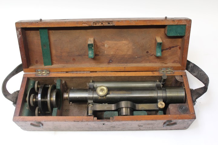 Brass surveyors' level, mount and spare eye lens, by Troughton & Simms, London,