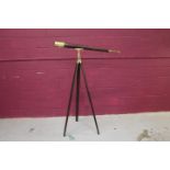 Large brass telescope with leather cover and mahogany tripod stand