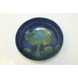 Moorcroft pottery bowl decorated in the Moonlit Blue pattern, impressed marks to base, 25.5cm