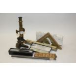 Brass students' microscope, an Otis Kings model K calculator, two slide rules, set square,