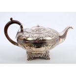 Late William IV silver teapot of compressed melon form,