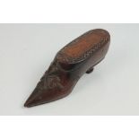 Early 19th century carved treen snuff shoe with sliding cover, relief carved with a shamrock, 11.