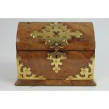 Victorian Gothic-style figured walnut and brass mounted tea caddy of domed rectangular form,