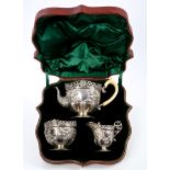 Fine quality Victorian three piece tea set comprising teapot of half-lobed cauldron form,
