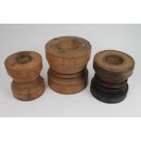 Three large Indian turned hardwood spice pestles, each of robust baluster form,
