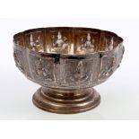 Indian white metal bowl of lobed form, with panels decorated with images of the deities,