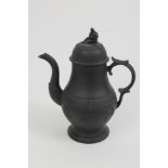 Early 19th century black basalt coffee pot of baluster form with double-S scroll handle,
