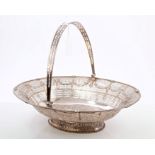 Early 19th century Old Sheffield Plate swing-handled cake basket of oval form, with floral swag