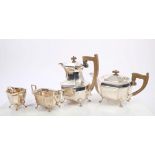 1930s Art Deco-style four piece tea set, comprising teapot of faceted form, with fruitwood handle,