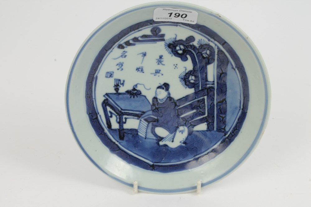 Chinese blue and white saucer dish decorated with a seated scholar in an interior six character