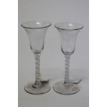 Pair Georgian wine glasses with bell-shaped bowls, opaque double-twist stems, on splayed foot,
