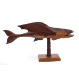 Pitcairn Islands miro wood model of a flying fish, raised on turned column and hardwood stand,