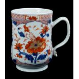 Large 18th century Chinese Imari baluster tankard of slightly swollen form on spread foot with strap