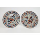 Pair of 18th century Chinese Imari circular dishes, each decorated with flowering chrysanthemums