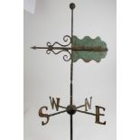 Antique green painted cast iron weather vane of traditional form,