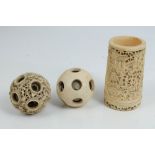 Carved Japanese ivory puzzle ball, typically relief carved and pierced with figures in landscapes,