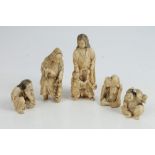 Group of five Japanese carved ivory okimonos, Meiji period, to include a mother and child group,