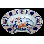 Unusual 18th century Chinese Imari barbers' bowl of oval dished form, with central landscape