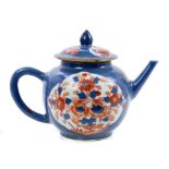 18th century Chinese bullet form teapot and cover with floral reserves painted in the Imari