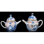 Near pair of 18th century Chinese Imari teapots and covers, each with bulbous knop to the domed