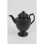 Early 19th century black basalt coffee pot and cover of baluster form, on circular foot, with