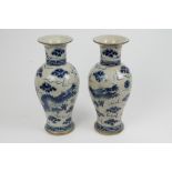 Decorative pair of Chinese baluster blue and white crackleware vases decorated with dragons on