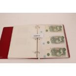 Banknotes - Great Britain - a red folder containing a selection of English Banknotes for the period