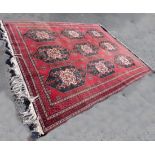 A Middle Eastern fringed end rug with nine central medallions with multi geometric borders, black,