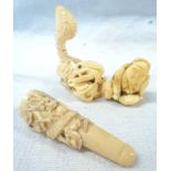 Three pieces of carved ivory, including a dragon, cheroot holder and a netzuke of a man