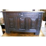 A 4' 2" early 18th Century oak triple panel coffer, with repeat motif and spangeled decoration to