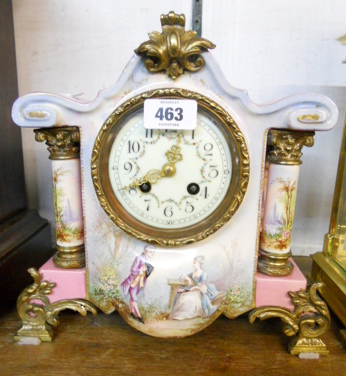 A 19th Century French ornate porcelain cased mantle clock, with gilt metal mounts, flanking