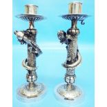 A pair of 7 1/4" Chinese white metal ornate candlesticks, the stems with applied air dragons on a