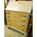 A 30" waxed pine bureau, with pigeon-hole and drawer fitted interior, with three long graduated