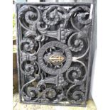 Three wrought iron foliate scroll balcony panels, with central anchor motif