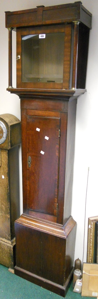 An antique stained oak longcase clock case with cross banded door - 6' 4" high