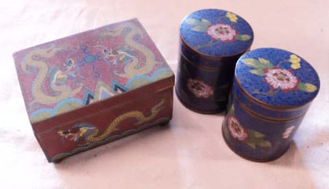 A pair of 3" circular lidded cloisonne jars with floral decoration - sold with a similar lidded
