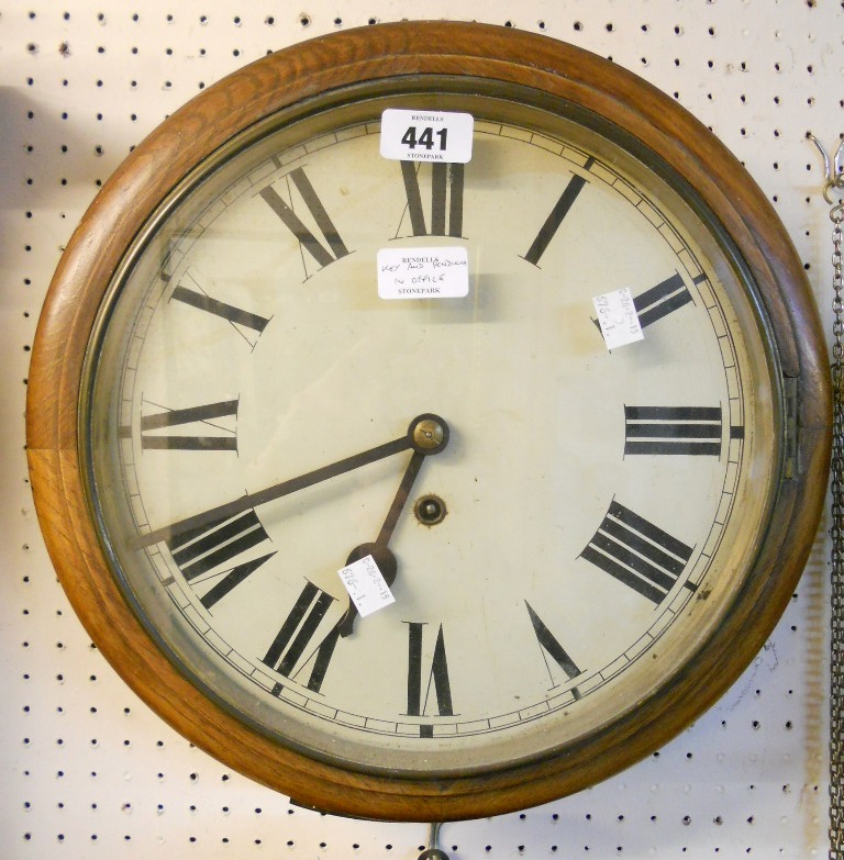 An oak cased dial wall clock, with spring driven timepiece movement