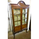 A 36" Edwardian mahogany display cabinet, with material lined interior enclosed by a pair of part