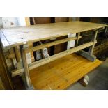 A 6' 1" antique French pine kitchen table, set  on twin flanking pegged supports