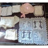 A collection of antique and vintage lace items and others, including cases, bonnet, handkerchiefs,